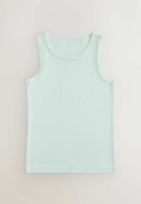 Vaaleanvihreä, hihaton puuvillainen tankkitoppi, jossa koristeelliset aaltoilevat tikit pääntien ja kainaloiden ympärillä, asetettuna tasaisesti vaalealle taustalle.