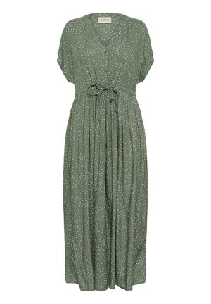 Grøn, knælang kjole med korte ærmer, V-hals, knappet front og en samlet talje snor. Har hvide prikker på stoffet.