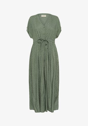 Roheline, põlvepikkune kleit lühikeste varrukatega, V-kaelusega, nupuliselt kinnitatud eesosas ja koos kätkrtud vööga. Kangas on kaunistatud valgete täppidega.