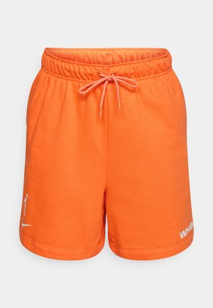 Orange cotton shorts with an elastic waistband and drawstring. Features a logo on the left leg in white. Smooth texture and casual design.