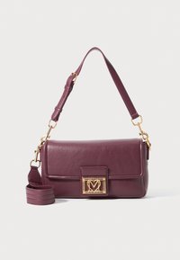 Dark purple leather shoulder bag with gold heart-shaped clasp and adjustable top strap on white background.