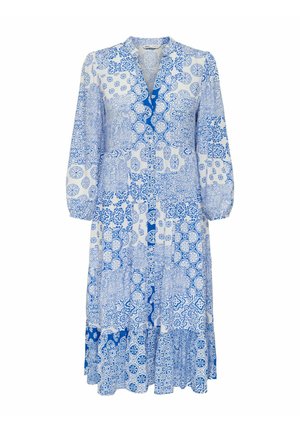 Sinine ja valge mustriga kleit V-kaelusega, pikkade varrukatega ning kihilise kleidi äärega. Omab keerukaid plaadilaadseid kujundeid kogu kleidi ulatuses.