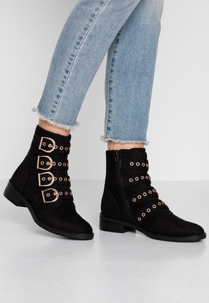 Botki kowbojki i motocyklowe