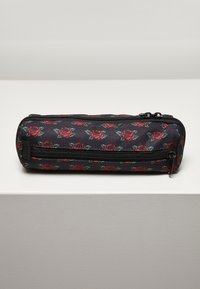 Black pencil case with red rose pattern, zip closure, compact cylindrical shape, made of durable fabric, features a small side pocket.