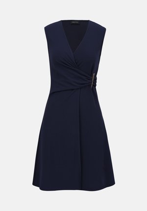 Sleeveless navy blue dress with V-neck, wrap style bodice gathered and secured with a decorative silver buckle on the side.