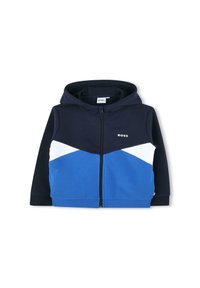 Sweatshirt zippé à capuche en mélange de coton, présentant des blocs de couleurs bleu marine, blanc et bleu avec un logo discret sur la poitrine.