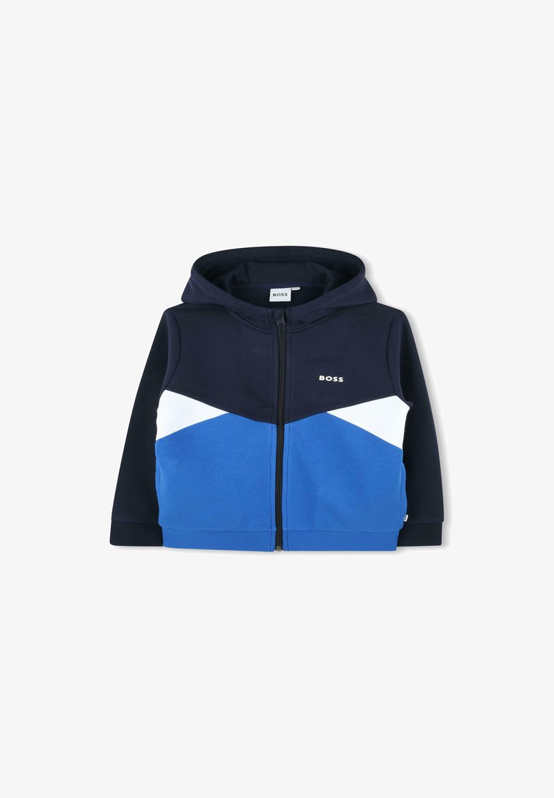 Sweatshirt zippé à capuche en mélange de coton, présentant des blocs de couleurs bleu marine, blanc et bleu avec un logo discret sur la poitrine.