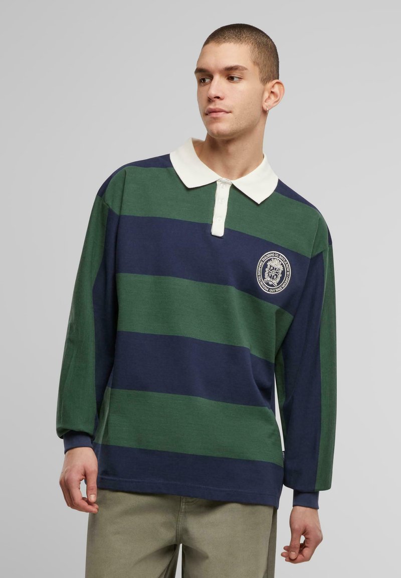 Green and navy striped long-sleeve polo shirt with a white collar and a left chest emblem. Made of soft fabric with a relaxed fit.