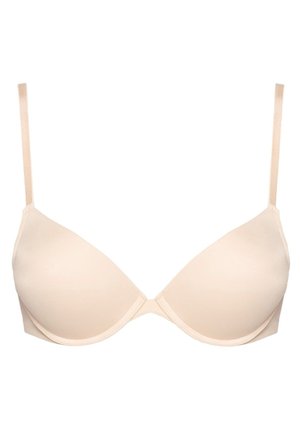 Beige gewatteerde bh met verstelbare bandjes, gladde textuur en een diepe halslijn. Naadloos ontwerp voor een discreet draagcomfort onder kleding.