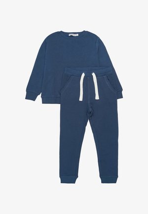Sweat-shirt bleu marine à manches longues et pantalon de jogging assorti avec cordon blanc et poignets élastiques, posé à plat sur un fond blanc.