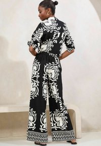 Lipsy PRINTED WIDE  - Nadrágok - black