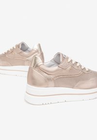 Metallic rose gold sneakers with a textured upper, smooth accents, and white rubber soles. Features contrasting laces and a padded tongue.
