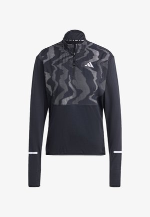 Sort atletisk pullover med lynlås i halsen, lange ærmer og et markant mønster på overdelen. Fremstillet af let og åndbart stof. Reflekterende detaljer.