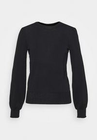 Musta neulepusero, jossa on pitkät liehukevät hihat, pyöreä pääntie ja resorit hihansuissa. Sileä pinta, vartalonmyötäinen siluetti ja ranteissa poimutetut yksityiskohdat.