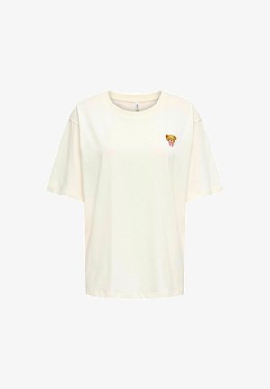 Korte ærmer cremefarvet t-shirt lavet af blød bomuld. Har en lille, broderet bjørn med en lyserød sløjfe på venstre bryst.