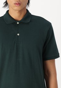 GAP Pólóing - essex green