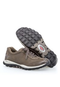 Brown leather sneakers with textured rubber soles, featuring a white midsole and grey accents. Rounded toe and lace-up design.