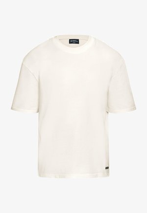 Weißes Baumwoll-T-Shirt mit Rundhalsausschnitt, kurzen Ärmeln und lockerer Passform. Hat ein kleines schwarzes Logo-Tag am unteren linken Rand.