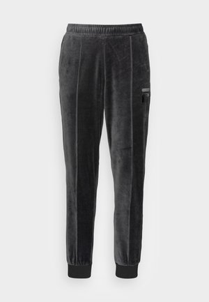 Pantalons de survêtement en velours noir avec taille à cordon, jambes fuselées, poches latérales et poignets côtelés. Détails de couture verticale.