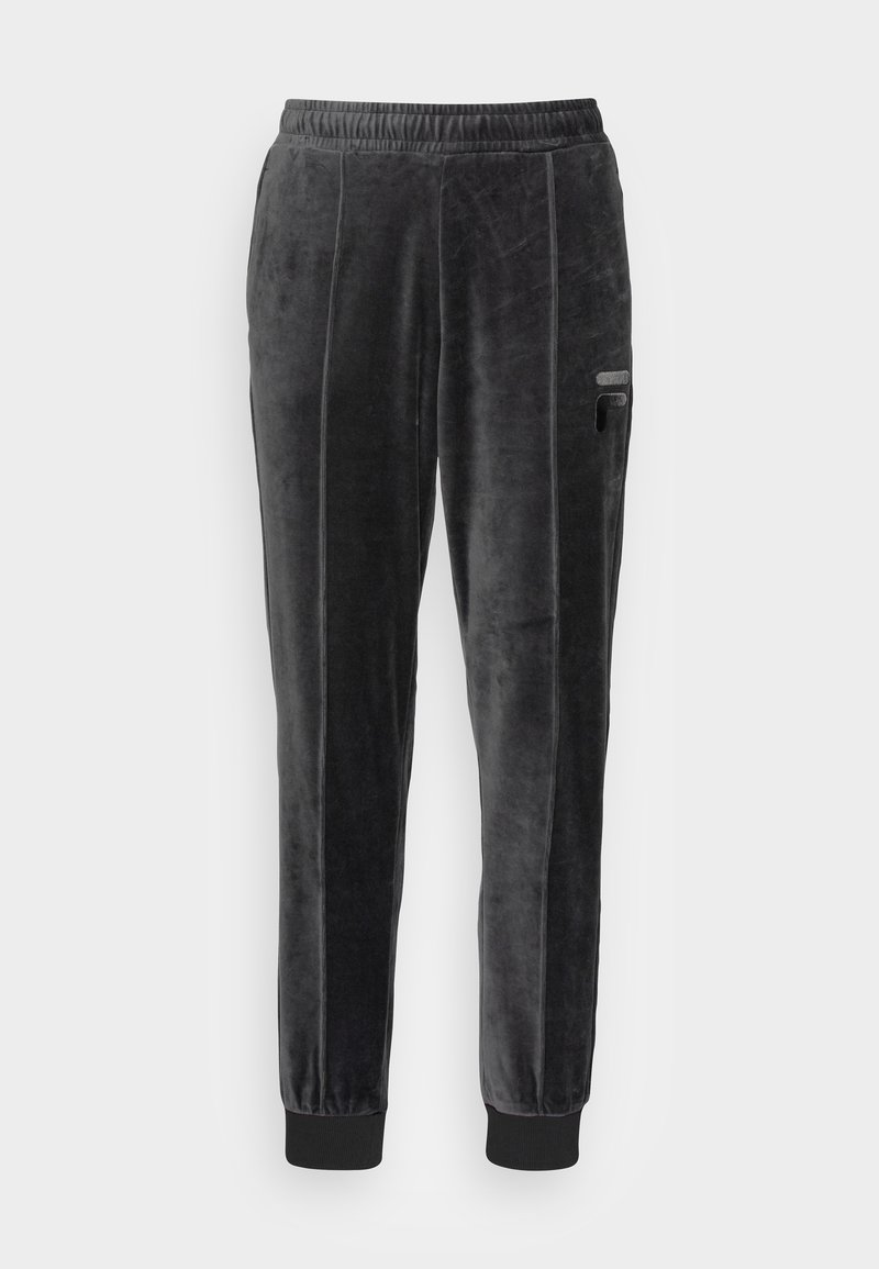 Svarta sammetssoffor med dragsko i midjan, avsmalnande ben, sidofickor och ribbade muddar. Har vertikala sömdetaljer.