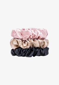 Set of three satin scrunchies in pastel pink, beige, and black. Features a soft, smooth texture with gathered fabric, each in a rounded shape.