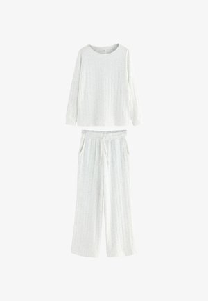 Light gray loungewear set featuring a long-sleeve top and elastic waistband pants. Both pieces have a subtle ribbed texture and pockets.