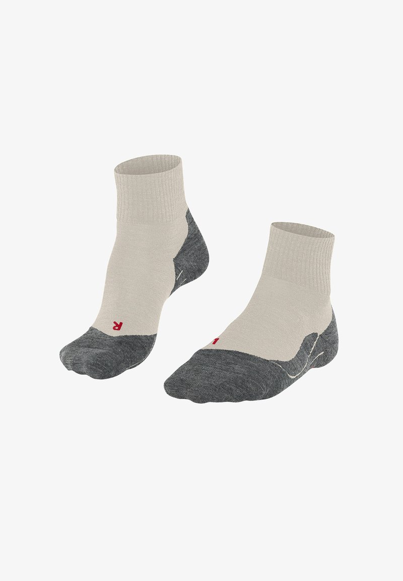 Chaussettes mi-mollet en mélange de coton, beige avec des accents gris foncé. Bordure côtelée, zones rembourrées au niveau des orteils et des talons avec détail logo rouge.