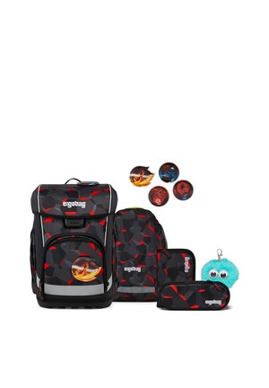 Black and red geometric backpack set with matching smaller bag, pencil case, four flame-themed badges, and blue fluffy keychain with eyes.