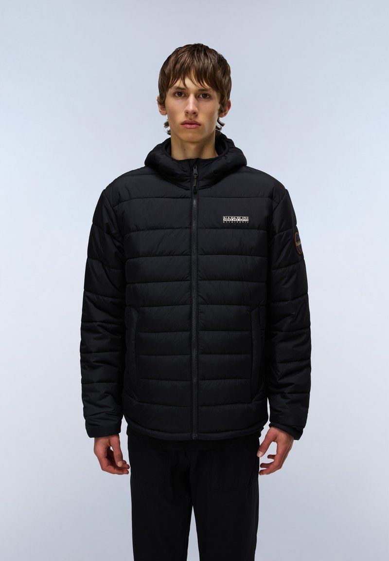 Black puffer jacket with a zip closure and a hood. Features quilted padding, side pockets, and a logo label on the chest. Smooth texture.