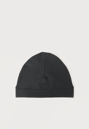 Bonnet en tricot noir avec un design simple, à plat sur fond blanc.