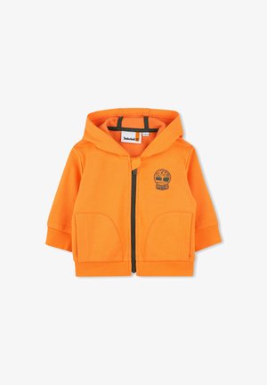 Felpa arancione con cappuccio in cotone, dotata di zip frontale, due ampie tasche, polsini a costine e logo Timberland sul petto.