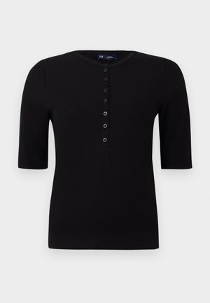 Top scurt negru cu dungi, cu guler rotund și o închidere cu butoane pe față, având butoane argintii și o siluetă ajustată.