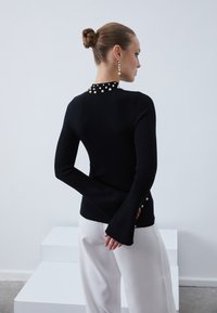 Anna Field Maglione - black
