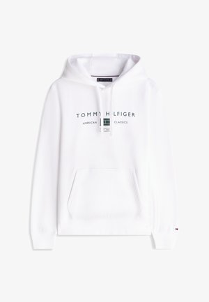 Witte hoodie met voorkantzak, capuchon met trekkoord en de tekst en het logo "Tommy Hilfiger American Classics" centraal op de borst.