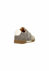 Gray suede sneaker with a contrasting white heel accent, flat brown rubber sole, and tonal gray side stripe detailing, textured surface.