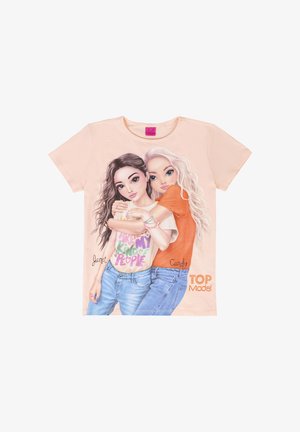 Light peach T-shirt featuring two cartoon characters, one in a white shirt with colorful text, the other in an orange shirt, with blue jeans.