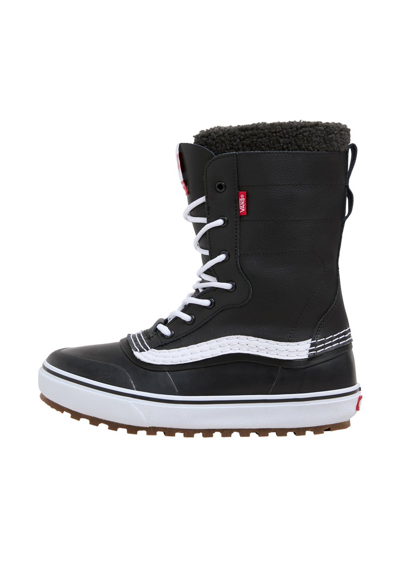 Black high-top boots with white laces, fur-lined collar, thick rubber sole, and contrasting white stitching. Features red brand tag on side.