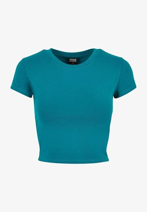 T-shirt teal tagliato in cotone, con maniche corte, scollatura rotonda e una texture liscia e monocolore. Nessun motivo o decorazione.
