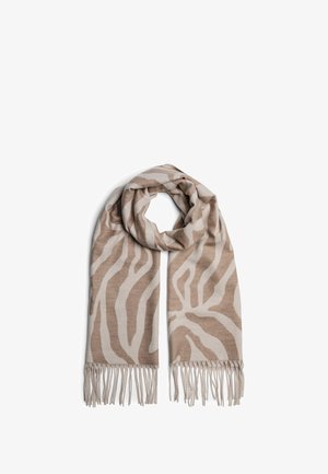 Béžová šála se zebřím vzorem v tmavší hnědé, zakončená třásněmi. Vyrobená z měkkého materiálu, má obdélníkový tvar.