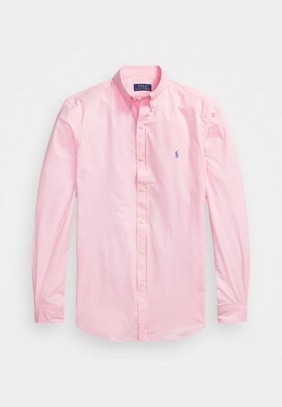 Rózsaszín, hosszú ujjú, gombos ing, pamutból készült. Klasszikus gallérral rendelkezik, puha tapintása van, és a bal mellen egy kék hímzett logó található.