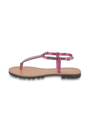 Pink metallic thong sandal with a flat sole, minimal strap design, and textured black rubber outsole. Adjustable ankle strap with buckle.