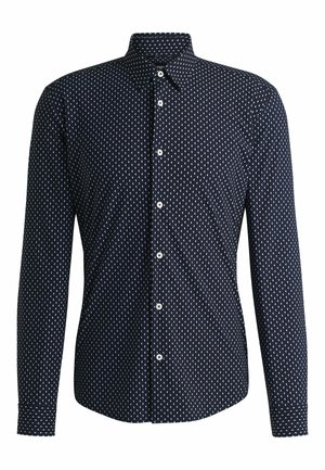 Marineblå skjorte med knapper, dekoreret med et geometrisk hvidt mønster, lange ærmer, spidse kraver og knapper foran. Glat stofstruktur.