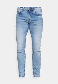 Ljusblå denimjeans med slim fit, utrustade med dragkedja, standard femfickdesign och subtila urblekta områden för ett slitet utseende.