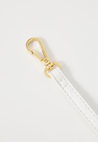 White leather strap with a textured surface, featuring a gold metal lobster clasp for secure attachment. Simple and functional design.