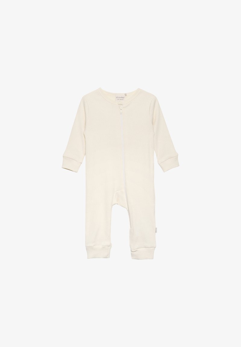 Body de couleur crème pour bébé, à manches longues, texture côtelée douce, fermeture éclair à l'avant et poignets ajustés. Aucun motif ni embellissement.