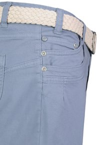 Light blue shorts with a braided cream belt. Features two front pockets and decorative stitching. Metal button accents near the waistband.