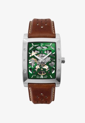Square stainless steel watch with a green skeleton dial, bronze accents, and a brown leather strap with stitched detail and perforations.