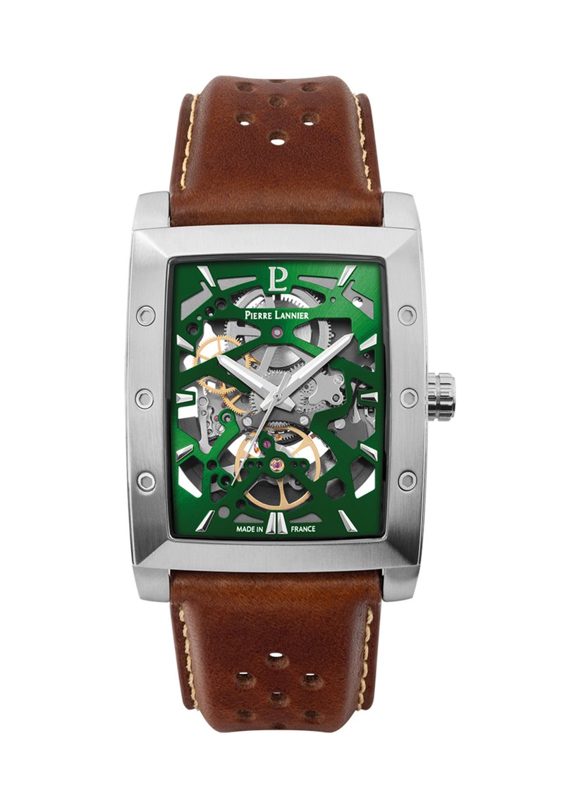 Square stainless steel watch with a green skeleton dial, bronze accents, and a brown leather strap with stitched detail and perforations.