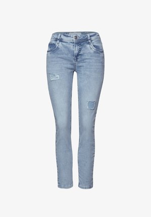 Skinny jeans in lichtblauwe denim, met versleten gebieden met scheuren en rafelige randen. Vijf-pocket ontwerp met een knoopsluiting.