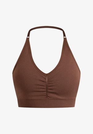 Bralette marron avec un design en V, devant froncé, fines bretelles et une bande élastique en bas pour le soutien. Texture lisse.